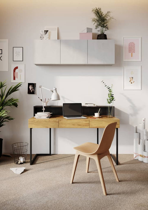 Modern home office with a wooden desk, chair, and decorative elements.