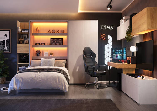 Modern bedroom with gaming setup, bed, and desk.