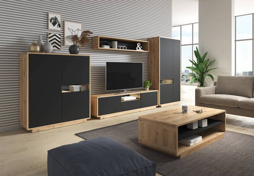 Modern living room with wooden entertainment center, TV, and sofa.