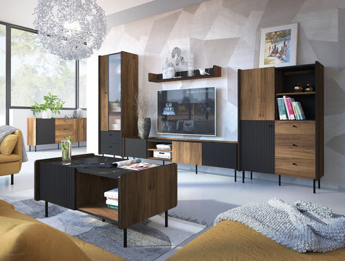 Modern living room with wooden entertainment center, TV, and decor
